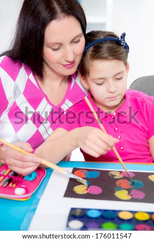 Mother  and daughter painting.