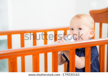 Baby Boy Standing in the crib