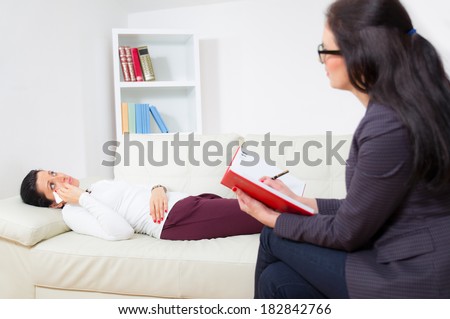 Woman reclining comfortably on a couch talking to his psychiatrist