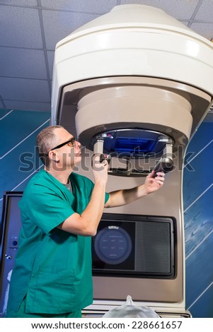 Radiotherapy room - Radiation therapy machine - Male radiologist