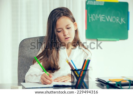 education and school concept - little student girl learn at home