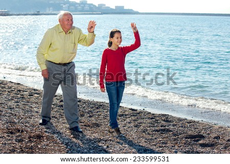 The old man walked by the sea with granddaughter