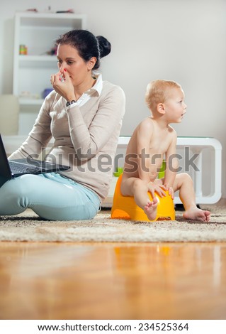 Working mother working at home and not watching his child to the potty
