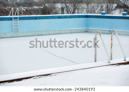 Empty swimming pool in winter conditions