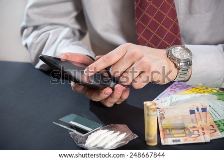 Loan shark with gun, money, drugs and tablet pc