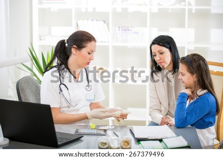 Alternative Medicine - Homeopathy.Young woman and her daughter at the doctor homeopaths. Treatment with herbs. Selective focus
