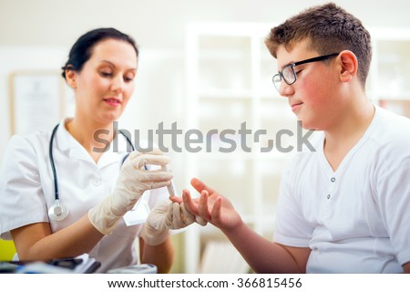 Measure child glucose level blood test diabetes little boy using glucometer