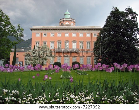 Classical mansion and lilac tulips in foreground. Lugano, Switzerland