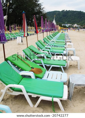 Row of sun beds at a tropical beach