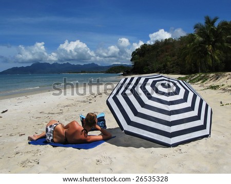 Young woman on a desert beach of Langkawi island, Malaysia