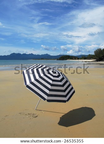 Sun umbrella on a secluded beach of Langkawi, Malaysia