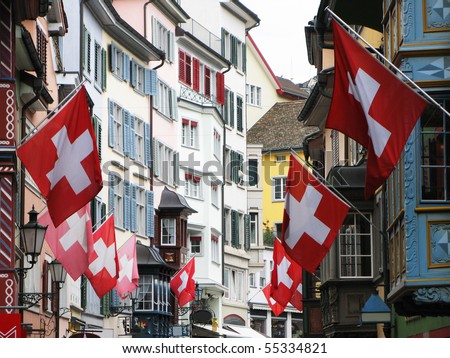stock-photo--old-street-in-zurich-decorated-with-flags-for-the-swiss-national-day-st-of-august-55334821.jpg
