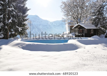 Swimming pool covered with snow