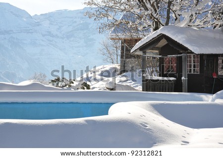 Swimming pool covered with snow