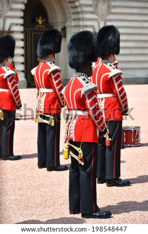 LONDON, UK a?? JUNE 12, 2014: British Royal guards perform the Changing of the Guard in Buckingham Palace