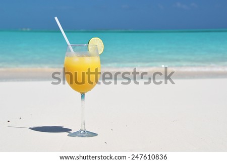 Orange juice on the beach. Great Exuma, Bahamas
