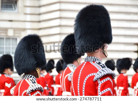 LONDON, UK - JUNE 12, 2014: British Royal guards perform the Changing of the Guard in Buckingham Palace