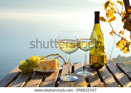 Wine and grapes against vineyards in Lavaux, Switzerland