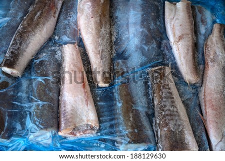 several slices of frozen fish