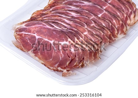 Delicatessen products cut into thin slices with a clearly visible structure and content of meat. The individual pieces of dried meat suitable for combining the commercials.