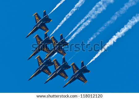 OCEAN CITY - JUNE 9:US Navy Blue Angels performing demo routine flying special painted f-18 Hornets on June 9, 2012 in Ocean City, Maryland. Blue Angels are the oldest demonstration team in the world