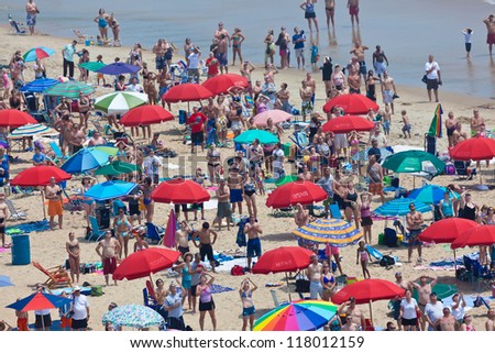 OCEAN CITY - JULY 9:Ocean City Maryland beach full of people on July 9, 2012 Ocean City MD is one of the most popular beach resorts on the East Coast and considered one of the cleanest in the country
