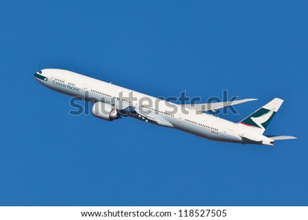 NEW YORK - OCT. 8:Boeing 777 Cathay Pacific climbs after take off from JFK Airport in New York on October 8, 2012. Cathay Pacific is the world\'s third largest airline.