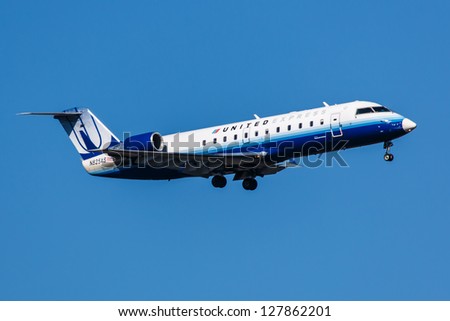 NEW YORK - DECEMBER 9:Embraer 145 United Airline on final to JFK airport located in New York, USA on December 9, 2012  United Airlines, a major U.S. airline, was founded in 1926