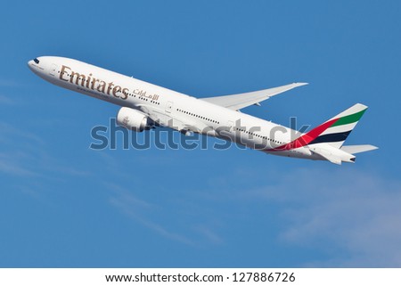 NEW YORK - DECEMBER 9: Boeing 777 Emirates climbs after take off from JFK Airport in New York on December 9, 2012. Emirates is rated as a top 10 best airlines in the world flying on youngest fleet