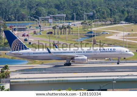 ORLANDO - SEPTEMBER 4: Continental Boeing 757 taxiing on Orlando Airport runway located in Orlando USA on September 4 2012 Boeing 757 was designed to replace the Boeing 727 and entered service in 1983