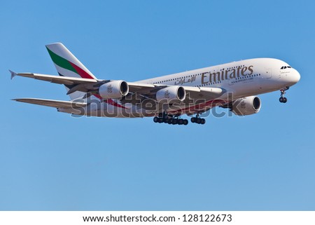 NEW YORK - JANUARY 9: A A380 Emirates approaches JFK airport in New York, USA on January 9 2012. Airbus A380 is the world\'s biggest jet airliner and the first to have two full decks