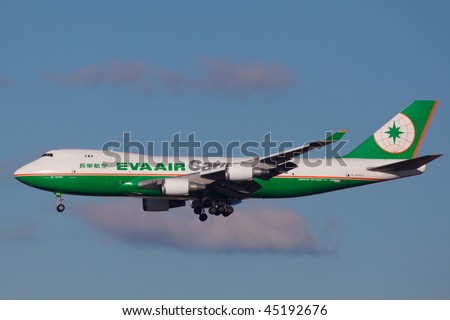 NEW YORK - JANUARY 5: A Boeing 747-400 (B-16483) EVA AIR Cargo from China  Arriving at JFK runway 22R on January 5, 2010 in New York. he Boeing 747 is a long-range, wide-body jumbo jet airliner