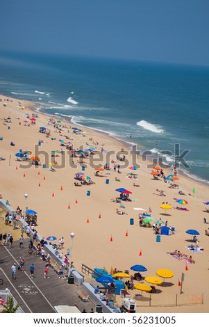 OCEAN CITY, MD - JUNE 25: View on the beach. Ocean City is a well known family resort located on the East Coast in Maryland state. Famous of Crabs and Beaches June 25, 2010 in Ocean City, MD.