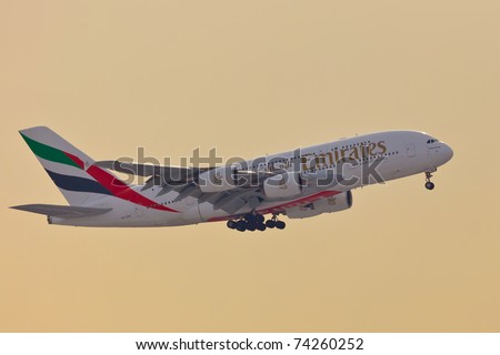 NEW YORK - JANUARY 2: A38 Emirates approaching JFK airport in New York, USA on January 2, 2011. A380 as of 2011 is the biggest commercial airplane and the newest plane built by Airbus company
