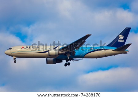 NEW YORK - MARCH 5:Delta Boeing 767 on approach to JFK in New York, USA on march 5, 2011. Plane is wearing very special livery called Habitat for Humanity the worldwide active humanitarian organization