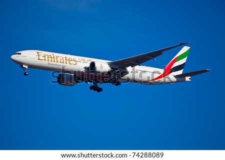 NEW YORK - JUNE 10: Boeing 777 Emirats on final approach to JFK airport located in New York, June 10, 2010. Emirates is rated as a top10 best airline in the world flying on youngest fleet