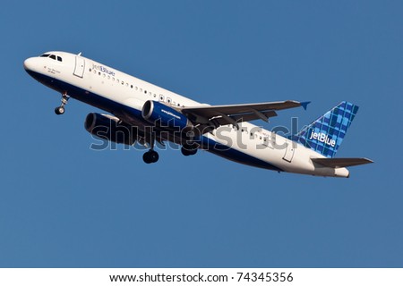 NEW YORK - JANUARY 15: A320 JetBlue on final approach to JFK in New York, USA on January 15, 2011. JetBlue is New York based, fastest growing airline in the world. They use Airbuses and Embraers