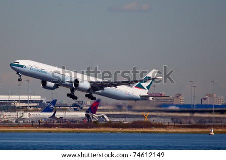 NEW YORK - FEBRUARY 1: Boeing 777 Cathey Pacific climbs after take off from JFK airport in New York, USA on February 1, 2011. Cathey, founded on September 24, 1946 is flag carrier airline of Honk Kong
