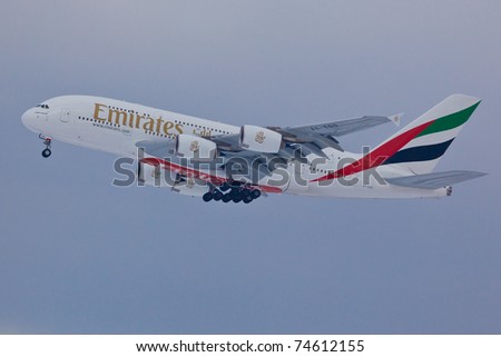 NEW YORK - MARCH 2: Airbus A380 Emirates approaching JFK airport located in New York, USA on March 2, 2011. A380 as of 2011 is the biggest plane ever used by commercial airlines in passengers transport