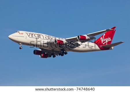 NEW YORK - MARCH 2: Boeing 747 Virgin Atlantic approaches JFK Airport in New York on March 2, 2011. Plane is wearing new house livery announced in early 2011 Boeing 747 is popularly called Jumbo Jet