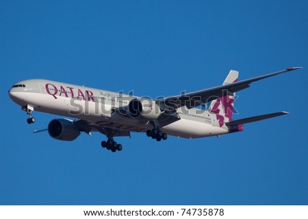 NEW YORK - MARCH 5:Boeing 777 Qatar on final approach to JFK in New York, USA on March 5, 2011 Qatar Airline is rated as top3 best airlines in the world. Qatar airline is flag carrier airline of Qatar