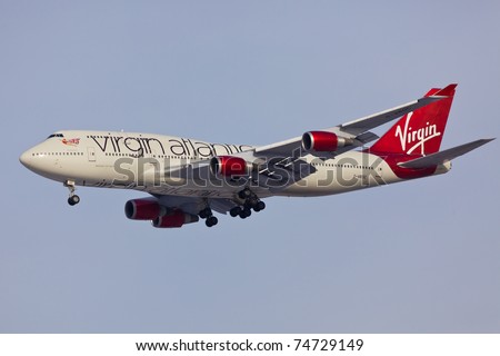 NEW YORK - MARCH 2: Boeing 747 Virgin Atlantic approaching JFK Airport in New York on March 2, 2011. Plane is wearing new house livery announced in early 2011. Boeing 747 is popularly called Jumbo Jet