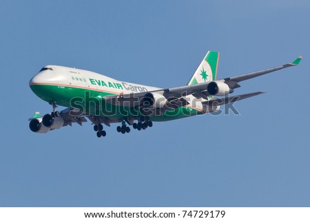 NEW YORK - MARCH 10 Boeing 747 EVA Cargo approaching JFK Airport in New York, USA on March 10, 2011 747 most popular cargo plane used by commercial airlines Her nickname: Queen of the sky
