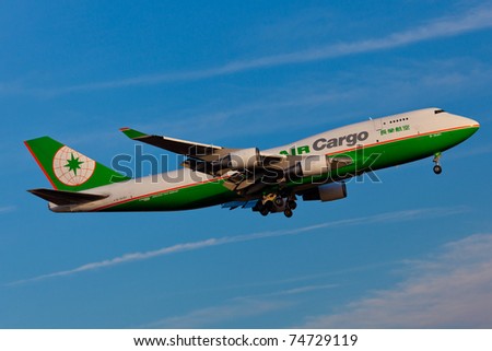 NEW YORK - MARCH 10: Boeing 747 EVA Cargo approaching JFK Airport in New York, USA on March 10, 2011. 747 most popular cargo plane used by commercial airlines Her nickname: Queen of the sky