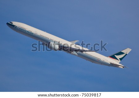 NEW YORK - FEBRUARY 9: Boeing 777 Cathey Pacific climbs after take off from JFK airport in New York, USA on February 9, 2011. Cathey, founded on September 24, 1946 is flag carrier airline of Honk Kong