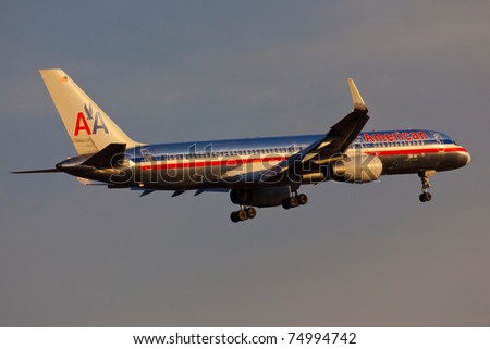 NEW YORK - MARCH 10: Boeing 757 American Airline approaches at dusk JFK in New York, USA on March 10, 2011. American Airlines is one of the biggest and oldest major American airlines