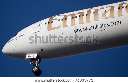NEW YORK - MARCH 7: Boeing 777 Emirats on final approach to JFK airport located in New York, March 7, 2010. Emirates is rated as a top 10 best airline in the world flying on youngest fleet