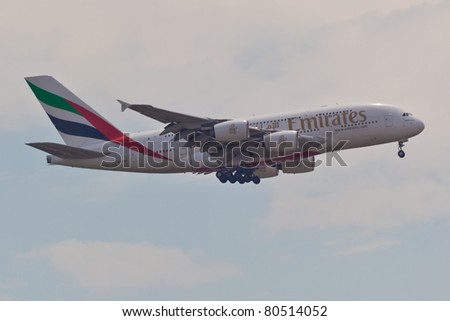 NEW YORK - MAY 2: A38 Emirates approaches JFK airport in New York, USA on May 2, 2011. A380 as of 2011 is the biggest commercial airplane and the newest plane built by Airbus company