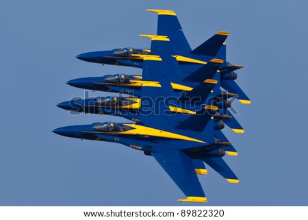 PENSACOLA, FL - NOVEMBER 11: The US Navy Blue Angels in F-18 Hornet planes perform in air show routine in Pensacola, FL on November 11, 2011. The Blue Angels are the oldest active aerobatic team in the world.