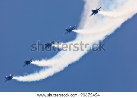 PENSACOLA, FL - NOVEMBER 11:US Navy Blue Angels in F-18 Hornet planes perform in air show routine in Pensacola, FL on November 11, 201. Blue Angels are the oldest active aerobatic team in the world